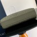 Stylish Dior A5 Triangle Pouch on a table