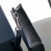 Dior A5 Triangle Pouch showcased in fashion magazine