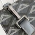 Dior A5 Triangle Pouch in a stylish flat lay