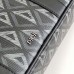 Close-up of Dior Briefcase Bag's polished finish