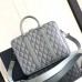 Dior Briefcase Bag displayed with laptop inside