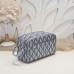 Dior Gray Toiletry Bag on a Vanity