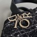Side view of Dior Toujours Medium Bag in black