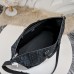 Dior Weekender 40 Black next to travel essentials