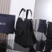 Side view of Dior Saddle Tote Bag with signature design