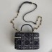 Replica Dior Caro Mini Vanity Case on a marble countertop