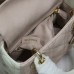 Iconic Mini Lady Dior Bag displayed on marble table