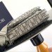 Close-up of Replica Dior Saddle Triple Bag design