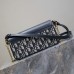 Replica Dior 30 Montaigne Mini Bag on a stylish surface