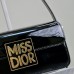 Luxury black Miss Dior Flap Bag on display