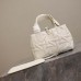 Side profile of Dior Toujours Bag